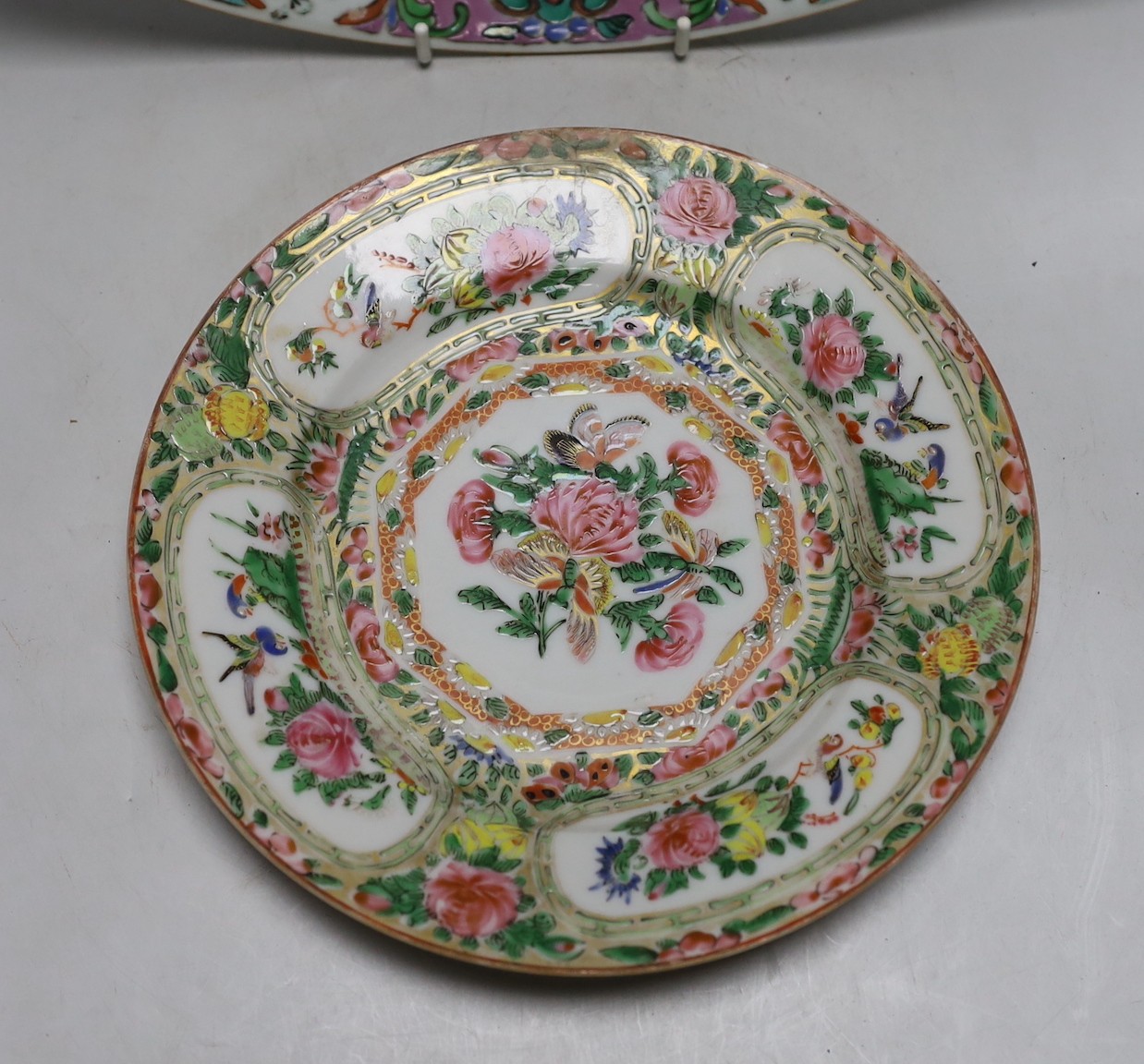 An 18th century Chinese enamelled charger and a Canton plate, charger 36cms